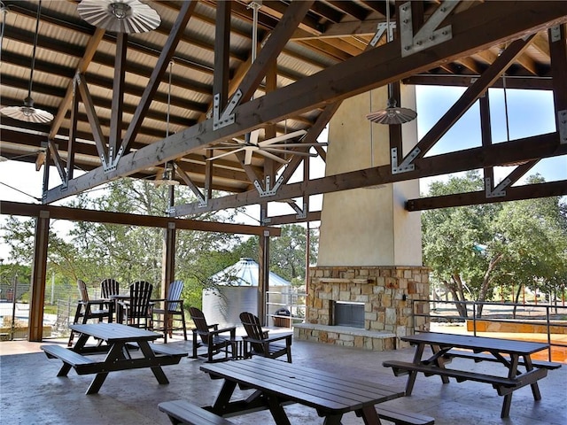 550 Cortona Ln, Georgetown, TX 78628 - view of patio with a gazebo, an outdoor stone fireplace, and a ceiling fan