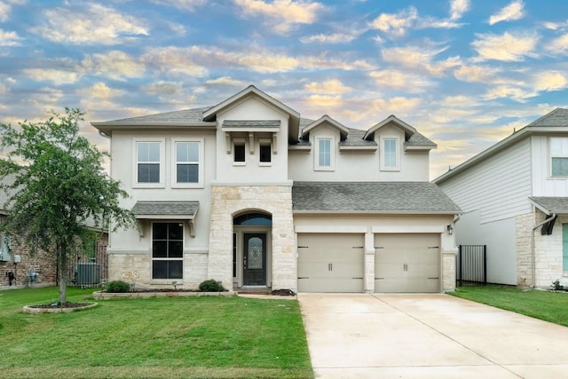 550 Cortona Ln, Georgetown, TX 78628 - view of front of home featuring stucco siding, stone siding, roof with shingles, an attached garage, and concrete driveway