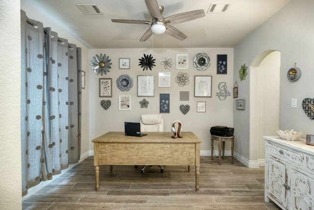 550 Cortona Ln, Georgetown, TX 78628 - office featuring ceiling fan, wood finish floors, arched walkways, and baseboards