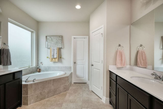 550 Cortona Ln, Georgetown, TX 78628 - full bathroom featuring a garden tub, vanity, and tile patterned floors