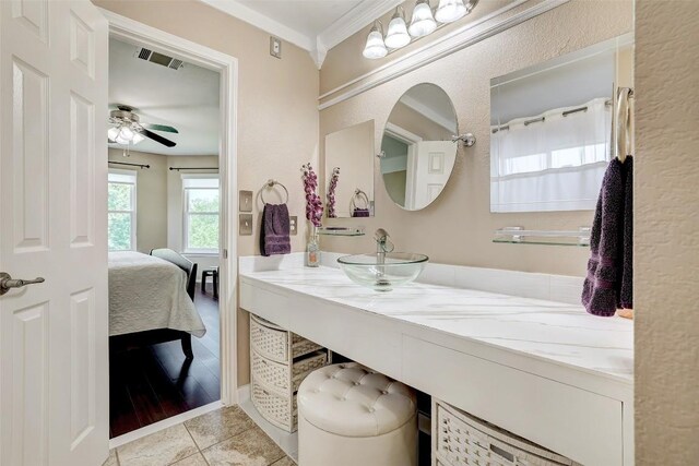 1060 Leeds Castle Walk, Georgetown, TX 78626 - ensuite bathroom with vanity, ceiling fan, tile patterned floors, and crown molding