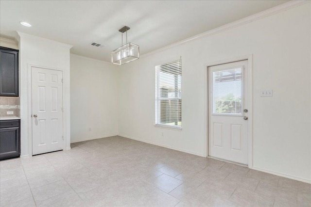186 Sundown Ave, Buda, TX 78610 - unfurnished dining area featuring ornamental molding, baseboards, and light tile patterned floors