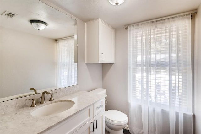 9214 Independence Loop, Austin, TX 78748 - half bath featuring toilet and vanity