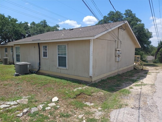 23393 Nameless Rd Unit 164, Leander, TX 78641 - view of home's exterior with central air condition unit and roof with shingles