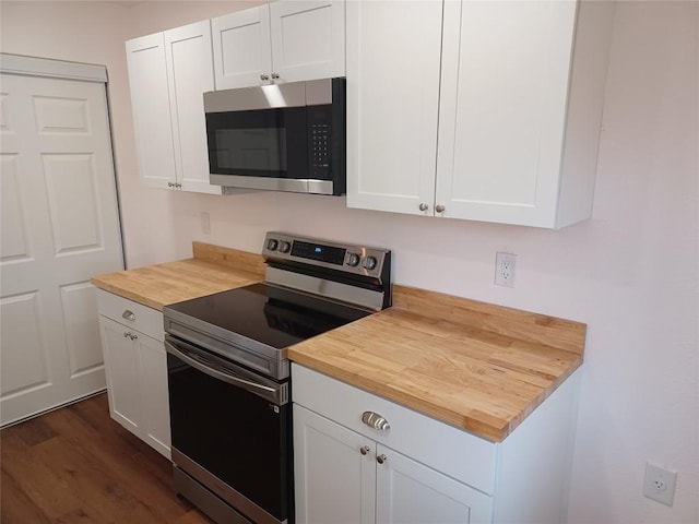 23393 Nameless Rd Unit 164, Leander, TX 78641 - kitchen featuring stainless steel appliances, wood counters, white cabinets, and dark wood finished floors