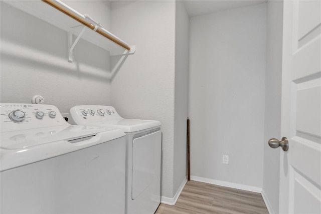 113 Bent Creek Ln, Georgetown, TX 78628 - laundry area featuring separate washer and dryer and light wood-style floors