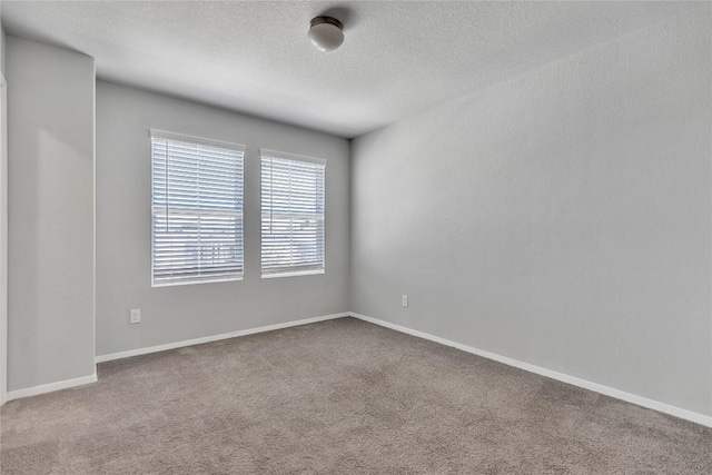 113 Bent Creek Ln, Georgetown, TX 78628 - carpeted empty room featuring a textured ceiling and baseboards