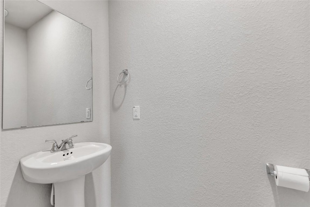 113 Bent Creek Ln, Georgetown, TX 78628 - bathroom with a textured wall and a sink