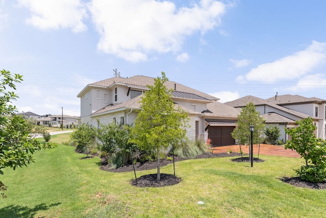 601 Gunison Dr, Lakeway, TX 78738 - view of green lawn with an attached garage