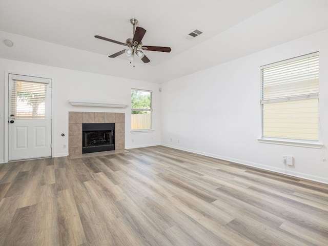 8425 Shallot Way, Austin, TX 78748 - unfurnished living room featuring ceiling fan, wood finished floors, healthy amount of natural light, and baseboards