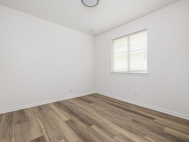 8425 Shallot Way, Austin, TX 78748 - spare room with wood finished floors and baseboards