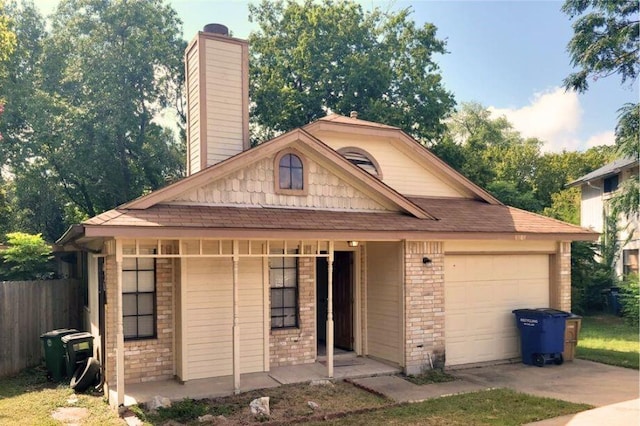 1121 Peggotty Pl, Austin, TX 78753 - view of front facade featuring an attached garage, concrete driveway, a chimney, brick siding, and a shingled roof