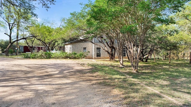 4414 Three Creek Trl, Spicewood, TX 78669 - view of side of home with stone siding