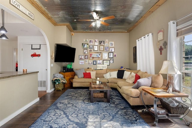4414 Three Creek Trl, Spicewood, TX 78669 - living room with ceiling fan, dark wood finished floors, arched walkways, and baseboards