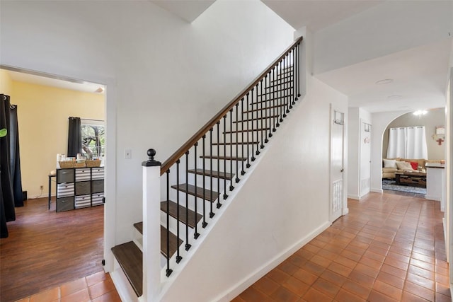 4414 Three Creek Trl, Spicewood, TX 78669 - stairs featuring tile patterned floors and baseboards