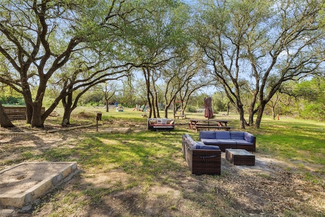 4414 Three Creek Trl, Spicewood, TX 78669 - view of green lawn featuring an outdoor living space