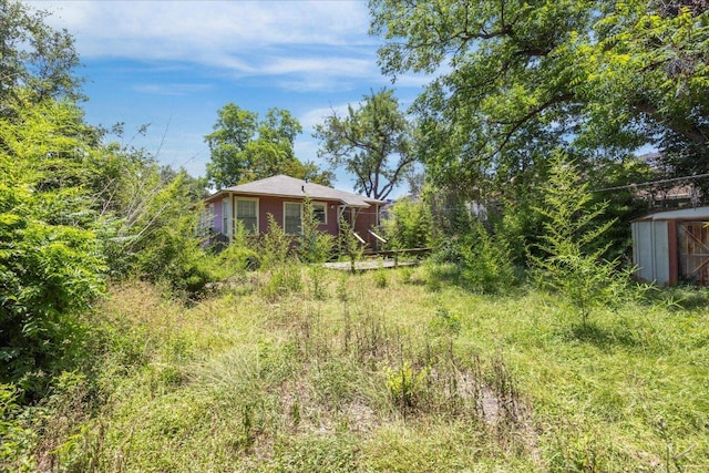 700 W N Loop Blvd, Austin, TX 78751 - view of yard with an outbuilding