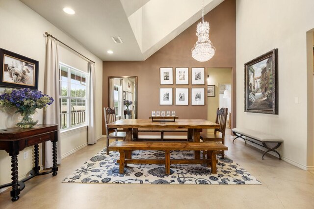 192 Indian Oaks Pass, Blanco, TX 78606 - dining space featuring a chandelier, concrete floors, recessed lighting, and high vaulted ceiling