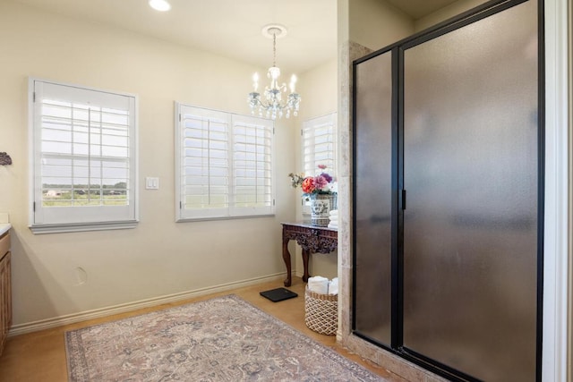 192 Indian Oaks Pass, Blanco, TX 78606 - full bath featuring a chandelier, vanity, healthy amount of natural light, and a shower stall