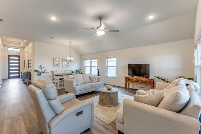 2212 Mcclendon Trl, Leander, TX 78641 - living area with ceiling fan, wood finished floors, lofted ceiling, recessed lighting, and a chandelier