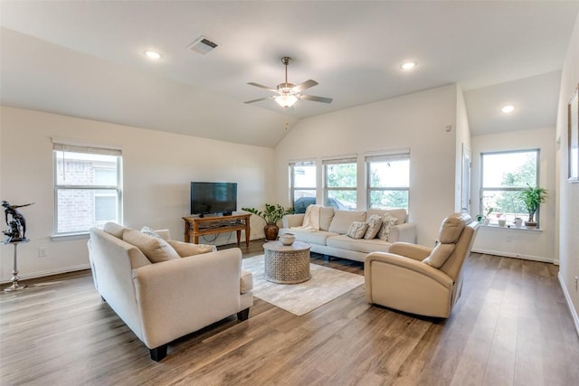 2212 Mcclendon Trl, Leander, TX 78641 - living room with wood finished floors, lofted ceiling, a ceiling fan, baseboards, and recessed lighting