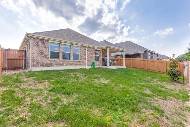 2212 Mcclendon Trl, Leander, TX 78641 - back of property with brick siding and a patio area