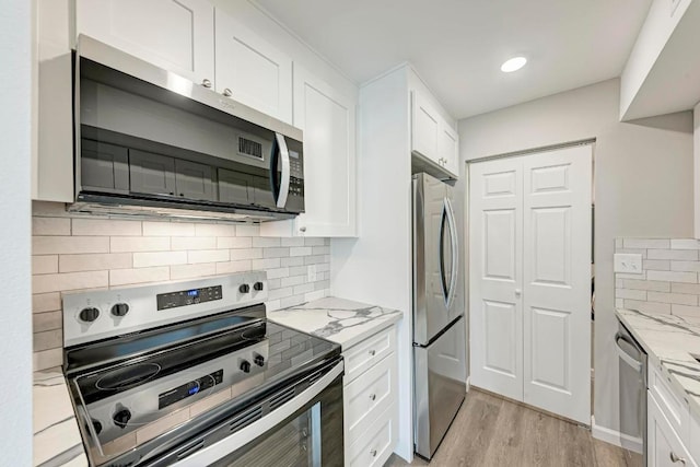 6718 Silvermine Dr Unit 804, Austin, TX 78736 - kitchen featuring stainless steel appliances, white cabinetry, light wood-style floors, and recessed lighting