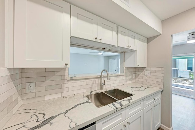 6718 Silvermine Dr Unit 804, Austin, TX 78736 - kitchen with white cabinetry, tasteful backsplash, and light stone countertops
