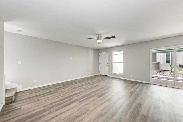 6718 Silvermine Dr Unit 804, Austin, TX 78736 - spare room featuring wood finished floors, a ceiling fan, and baseboards
