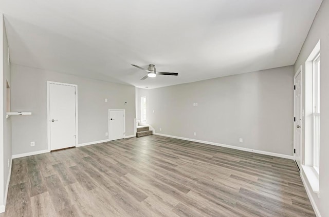 6718 Silvermine Dr Unit 804, Austin, TX 78736 - unfurnished living room with wood finished floors, ceiling fan, and baseboards