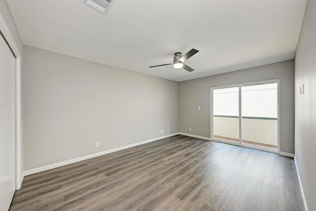 6718 Silvermine Dr Unit 804, Austin, TX 78736 - unfurnished bedroom featuring wood finished floors, baseboards, a ceiling fan, a closet, and access to exterior