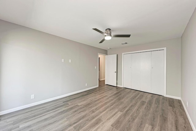 6718 Silvermine Dr Unit 804, Austin, TX 78736 - unfurnished bedroom featuring wood finished floors, baseboards, a closet, and a ceiling fan