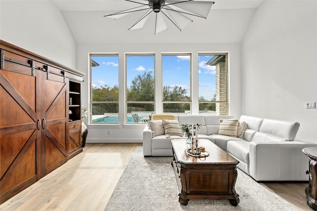116 Egret Ln, Austin, TX 78737 - living room with lofted ceiling, light wood-style flooring, and plenty of natural light