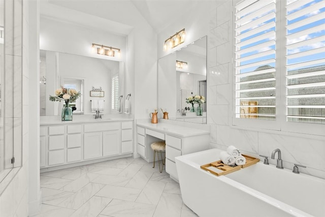 116 Egret Ln, Austin, TX 78737 - full bathroom featuring a freestanding tub, marble finish flooring, and vanity