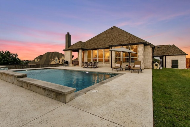 116 Egret Ln, Austin, TX 78737 - pool at dusk featuring a patio area