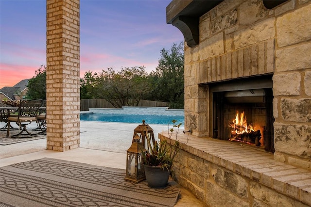116 Egret Ln, Austin, TX 78737 - view of swimming pool featuring an outdoor stone fireplace and a patio