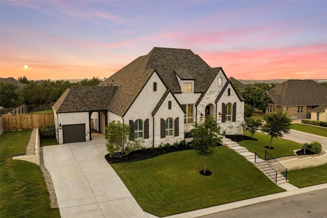 116 Egret Ln, Austin, TX 78737 - french country inspired facade featuring stone siding, concrete driveway, an attached garage, and a shingled roof