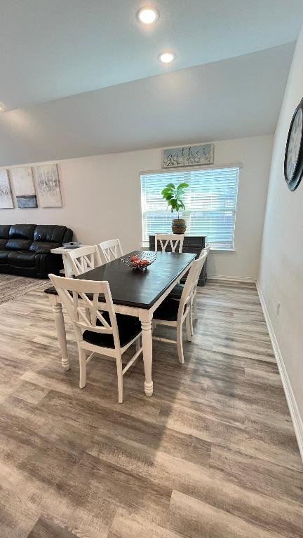 157 Monroe Dr, Kyle, TX 78640 - dining space with wood finished floors, baseboards, and recessed lighting