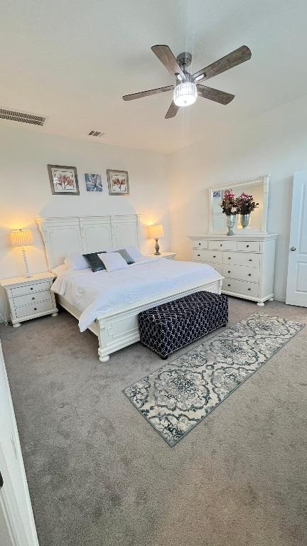 157 Monroe Dr, Kyle, TX 78640 - carpeted bedroom featuring ceiling fan