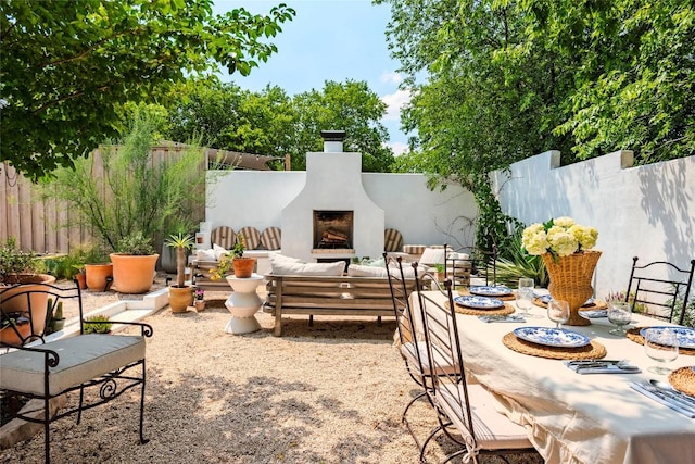 8608 Georgian Dr, Austin, TX 78753 - fenced backyard with exterior fireplace and a patio