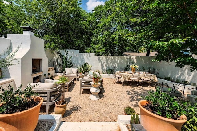 8608 Georgian Dr, Austin, TX 78753 - view of yard with a patio and an outdoor living space with a fireplace