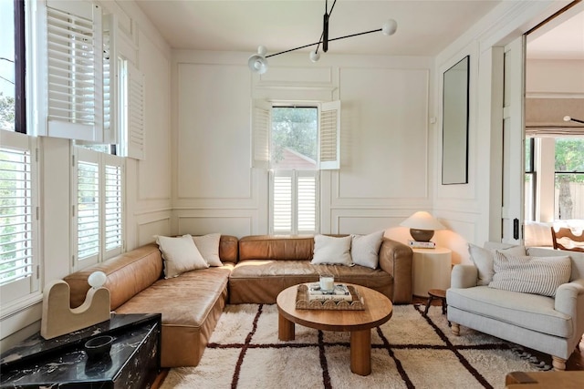 8608 Georgian Dr, Austin, TX 78753 - living area with a decorative wall and a chandelier