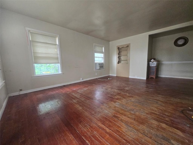 121 E Guadalupe St, La Grange, TX 78945 - spare room with hardwood / wood-style floors, built in features, and baseboards
