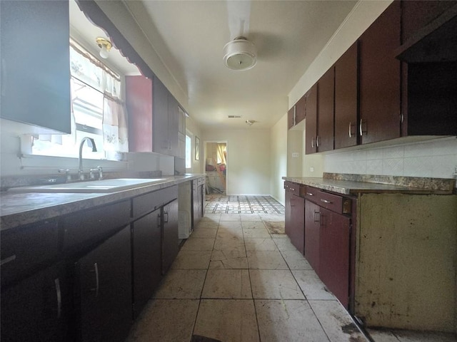 121 E Guadalupe St, La Grange, TX 78945 - kitchen featuring a sink and backsplash
