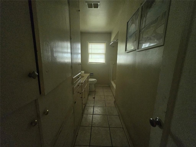 121 E Guadalupe St, La Grange, TX 78945 - full bath featuring toilet, vanity, shower / tub combination, and tile patterned floors