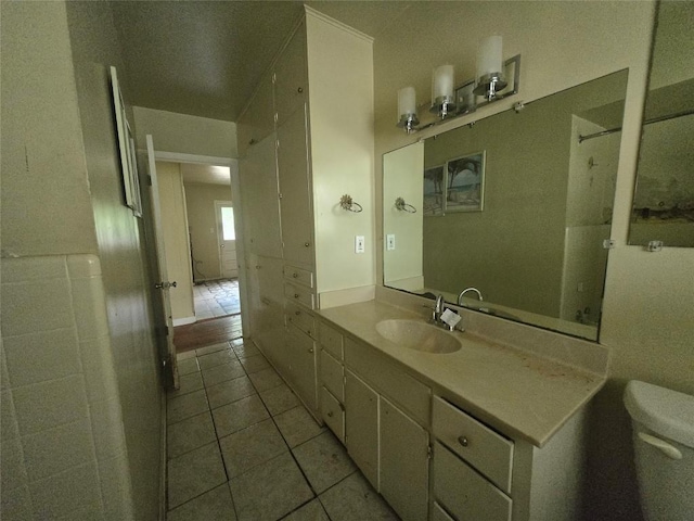 121 E Guadalupe St, La Grange, TX 78945 - bathroom featuring toilet, vanity, and tile patterned flooring