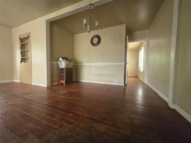 121 E Guadalupe St, La Grange, TX 78945 - spare room with hardwood / wood-style flooring, baseboards, and built in shelves