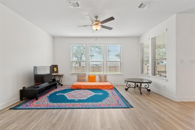 1305 Crescent Ln, Georgetown, TX 78633 - sitting room with healthy amount of natural light, ceiling fan, and wood finished floors