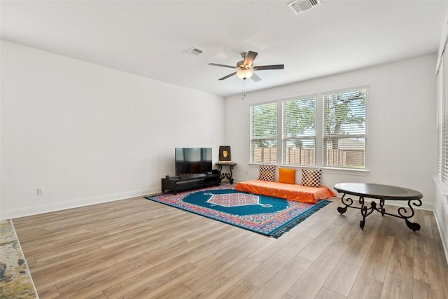 1305 Crescent Ln, Georgetown, TX 78633 - sitting room featuring ceiling fan, wood finished floors, and baseboards