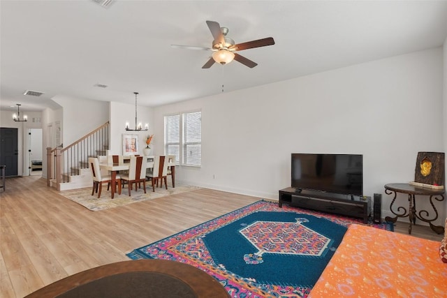 1305 Crescent Ln, Georgetown, TX 78633 - living area with a chandelier, a ceiling fan, wood finished floors, and baseboards